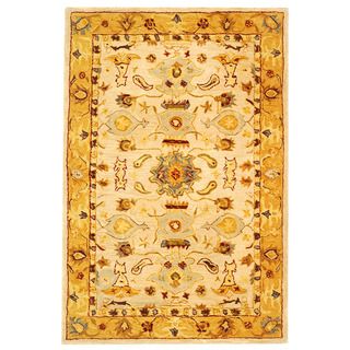 Handmade Tribal Ivory/ Gold Wool Rug (2 X 3) (IvoryPattern: OrientalMeasures 0.625 inch thickTip: We recommend the use of a non skid pad to keep the rug in place on smooth surfaces.All rug sizes are approximate. Due to the difference of monitor colors, so