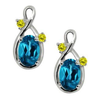 1.18 Ct Oval London Blue Topaz and Canary Diamond 18k White Gold Earrings: Jewelry