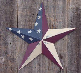 53 Inch Heavy Duty Metal Barn Star Painted Solid Olde Glory. The Colors in the Olde Glory (American Flag) Theme Are Burgundy, Beige, and Whale Blue. The Rustic Paint Coverage Starts with a Black or Contrasting Base Coat and Then the Star Color Is Hand Pain