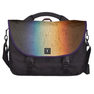 Colors of the rainbow on the surface of concrete laptop commuter bag