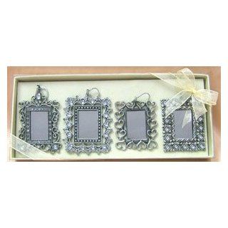 Pewter X mas photo ornaments adorned with Czech rhinestones and beautiful clear gems; This multi functional ornament can be a mirror or photo frame; they can also be hanged or placed on table top. It comes in a set of 4 packaged in a deluxe box. Place the 