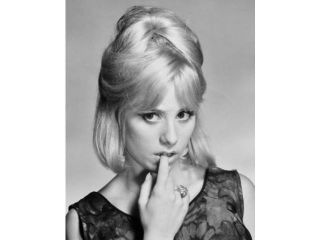 Portrait of a young woman biting her nails Poster Print (18 x 24)
